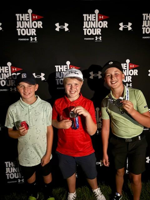Andrew Walton, Lucas Robinson, Parker McNulty with junior golf trophies and medals